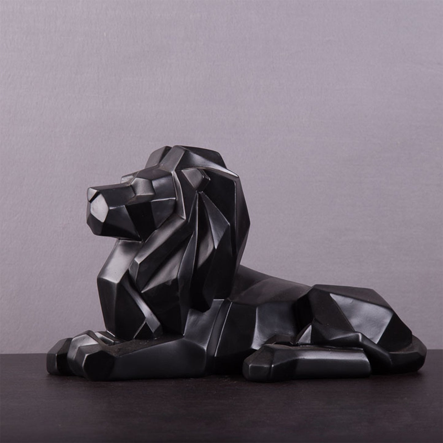 Statuette lion couché