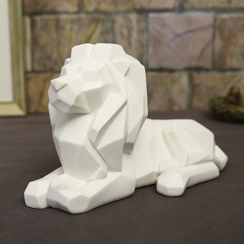 Statuette lion couché