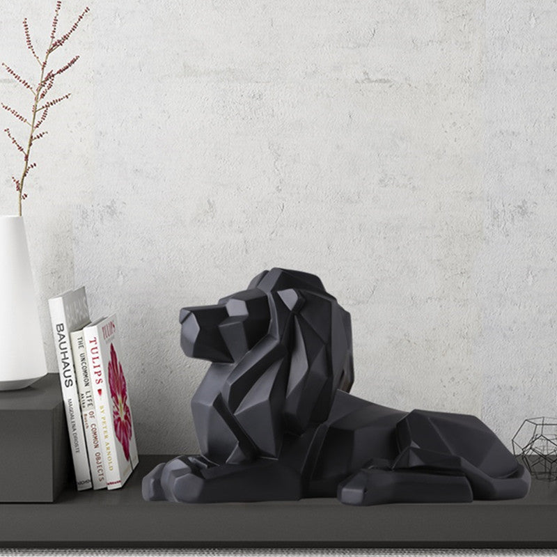 Statuette lion couché