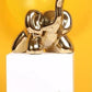 Statuette éléphant doré en ballon de baudruche