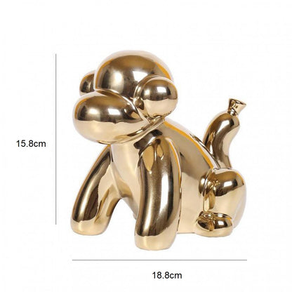 Statuette singe doré en ballon de baudruche
